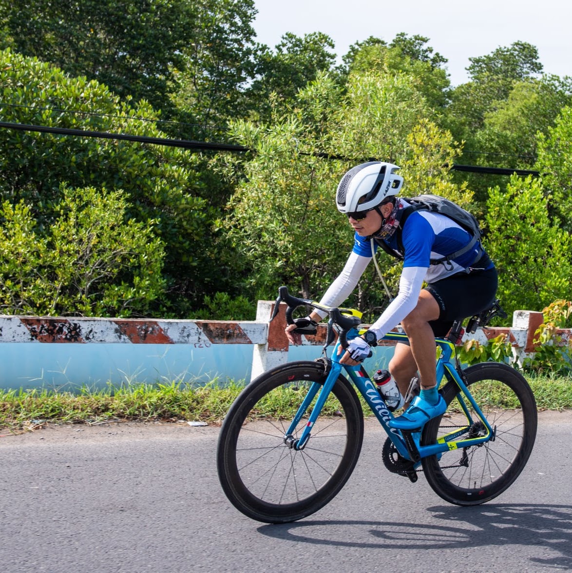 A person cycling on a mountain road